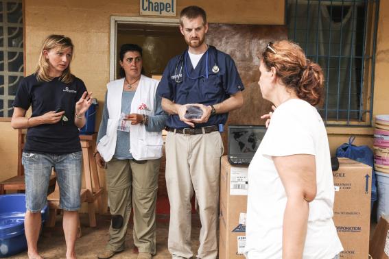 Dr. Kent Brantly (2nd R) speaks with colleagues at the case management center on the campus of ELWA Hospital in Monrovia, Liberia in this undated handout photograph courtesy of Samaritan's Purse. REUTERS-Samaritan's Purse-Handout via Reuters